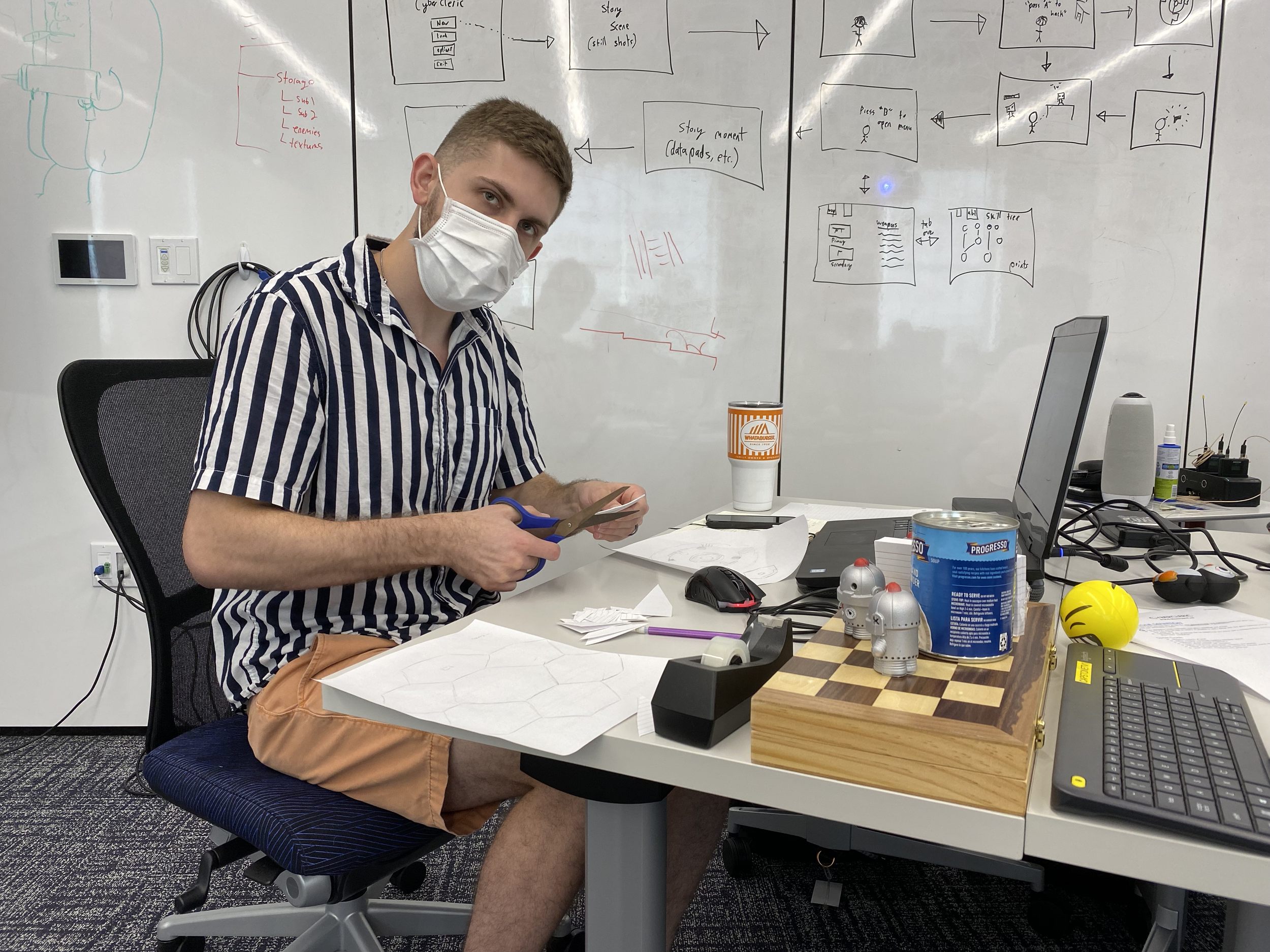 Photo of Dakota making a paper prototype for the boss level.