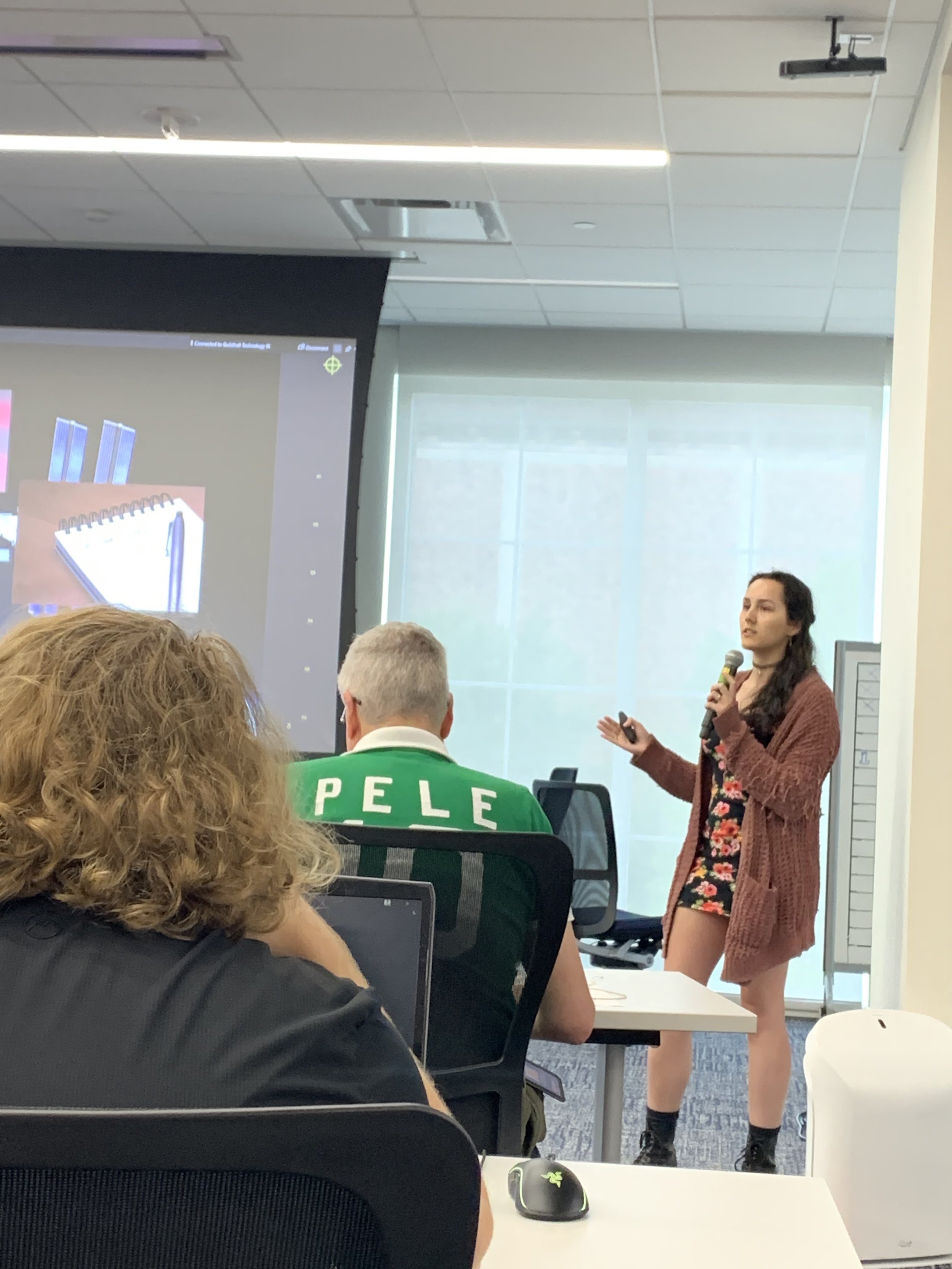 Photo of Nooka presenting the narrative to the team and stakeholders.